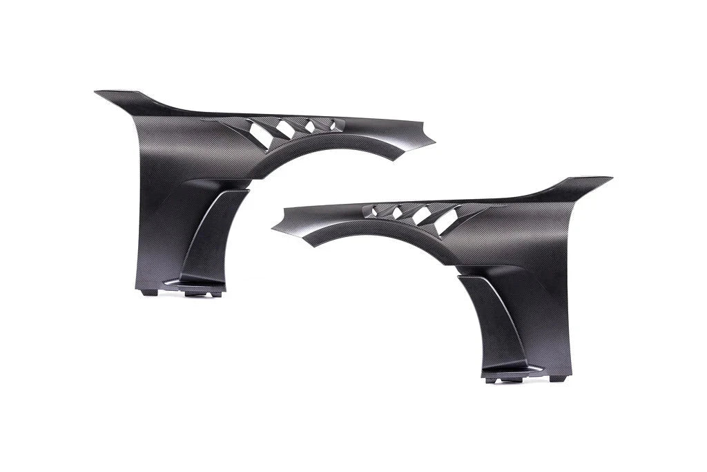 Vented black carbon fiber automotive fenders for enhanced performance