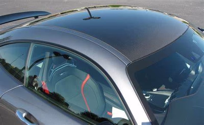 Silver car with carbon fiber roof and tinted windows