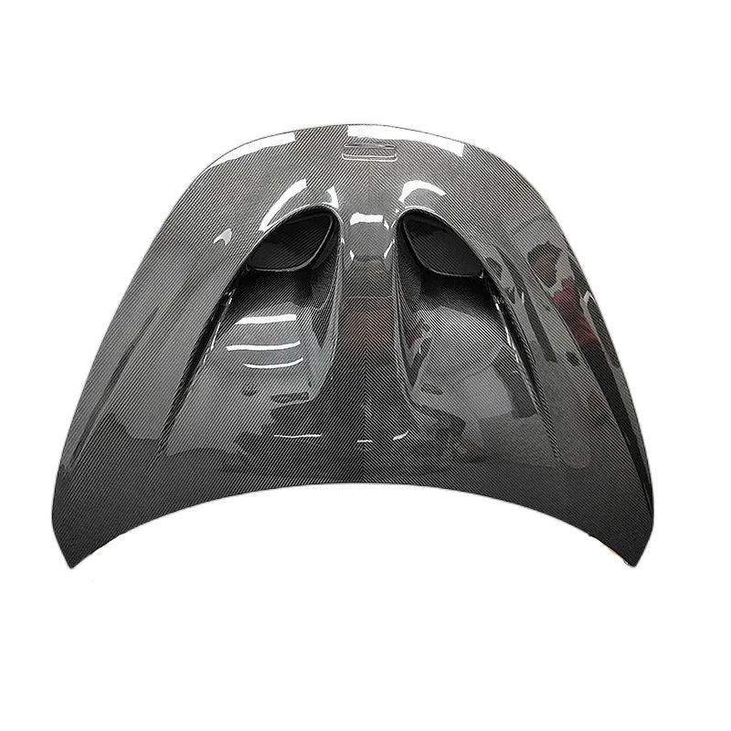 Glossy gray dry carbon fiber car hood with vents and contoured shape