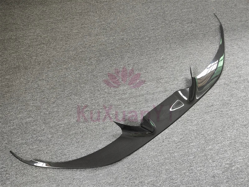 Car underbody panel with aerodynamic diffuser and trim pieces