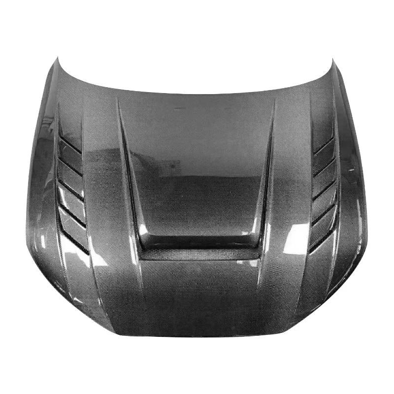 Dry carbon fiber car hood with vents and raised center section